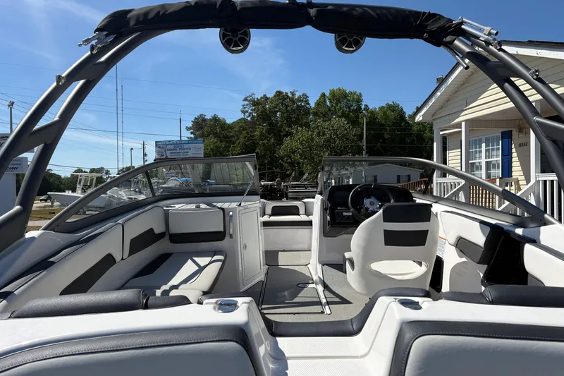 Slide: The Image of 2021 Yamaha Boats AR195 interior with sleek seating and modern dashboard design. - 6