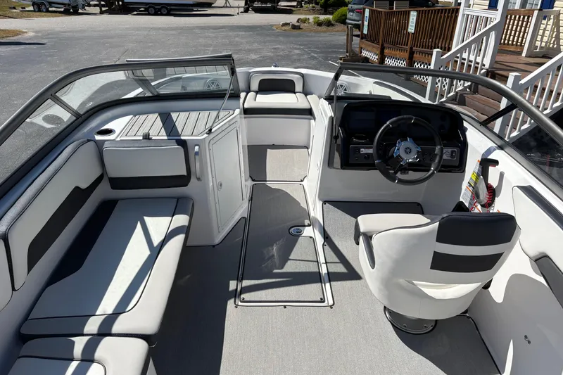 Slide: The Image of 2021 Yamaha Boats AR195 interior with seating, steering wheel, and dashboard. - 7