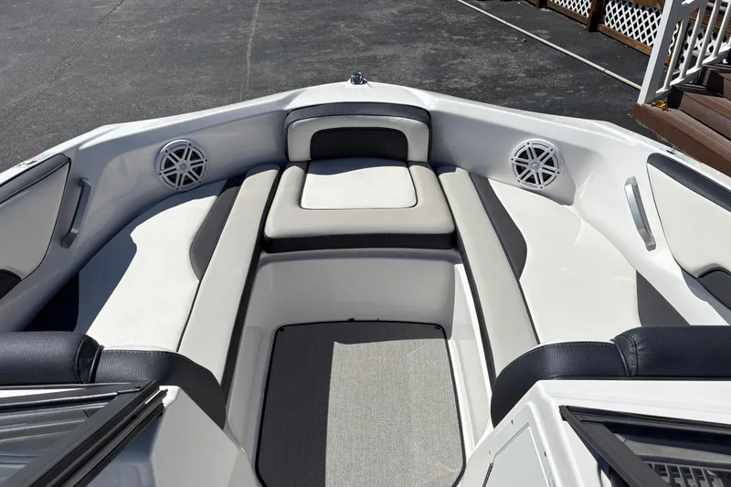 Slide: The Image of 2021 Yamaha Boats AR195 interior with cushioned seating and speakers. - 9