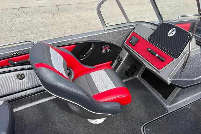 Slide: The Image of 2023 Ranger 2050MS boat interior with red and gray seating and dashboard. - 14