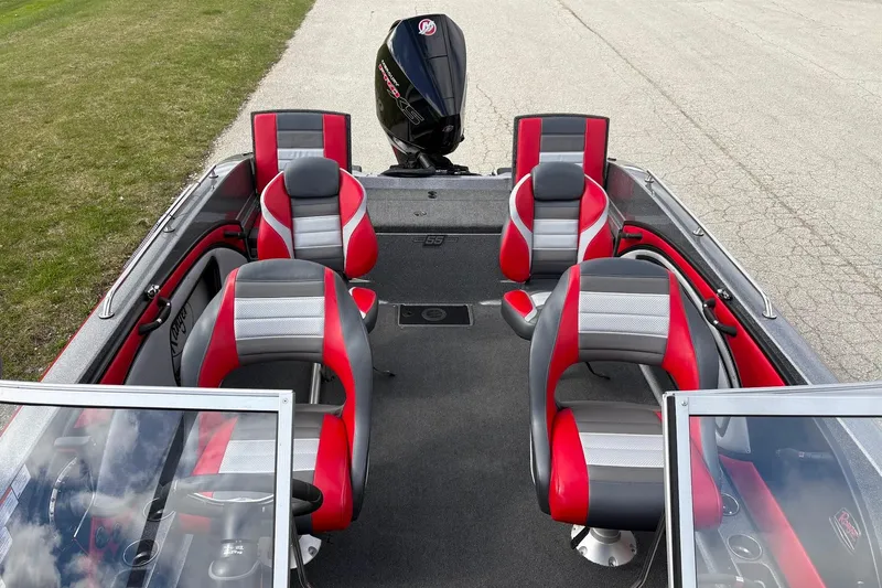 Slide: The Image of 2023 Ranger 2050MS boat interior with red and gray seating, featuring a powerful outboard motor. - 15