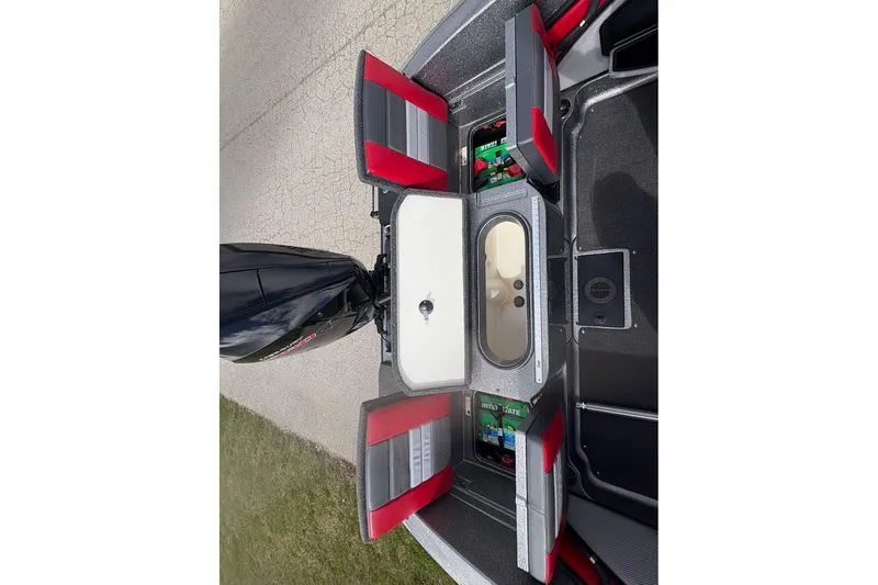 Slide: The Image of 2023 Ranger 2050MS boat storage compartments with open lids, showcasing interior organization. - 16