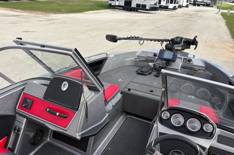 Slide: The Image of 2023 Ranger 2050MS boat interior with modern dashboard and fishing equipment. - 9