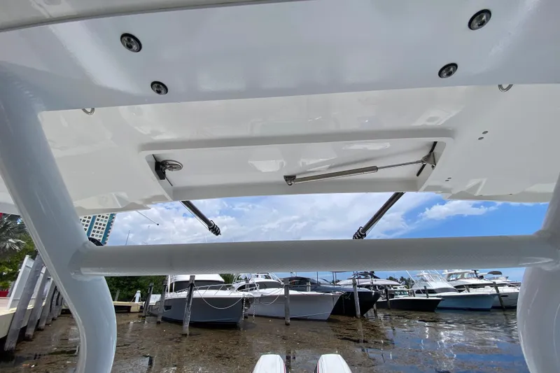 Slide: The Image of 2022 Blackfin 332 CC boat detail with marina view in the background. - 10