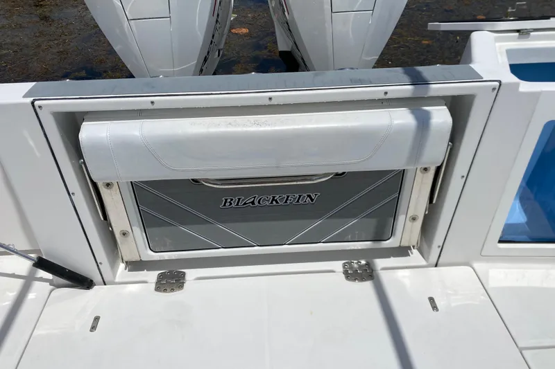 Slide: The Image of 2022 Blackfin 332 CC boat with foldable seat and dual outboard engines. - 28