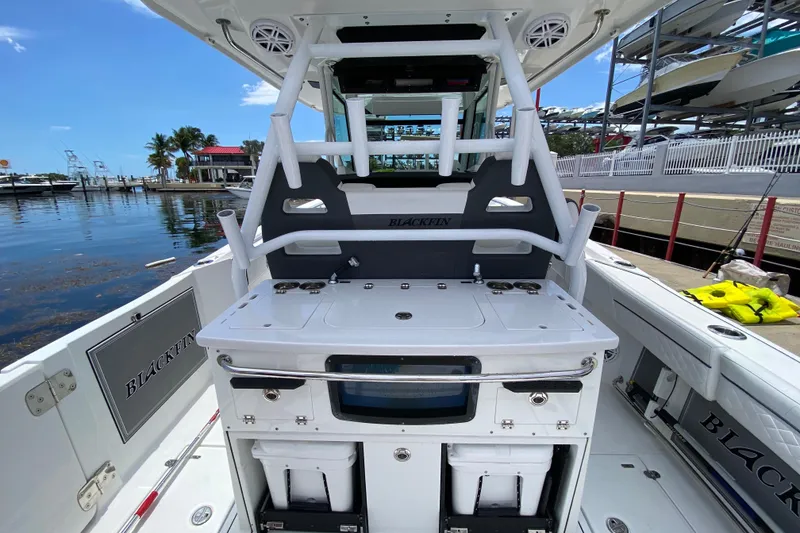 Slide: The Image of 2022 Blackfin 332 CC boat interior with fishing station and storage compartments. - 6