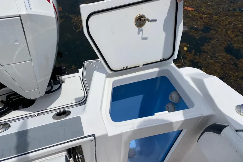 Slide: The Image of Open storage compartment on a 2022 Blackfin 332 CC boat, showcasing interior details. - 17