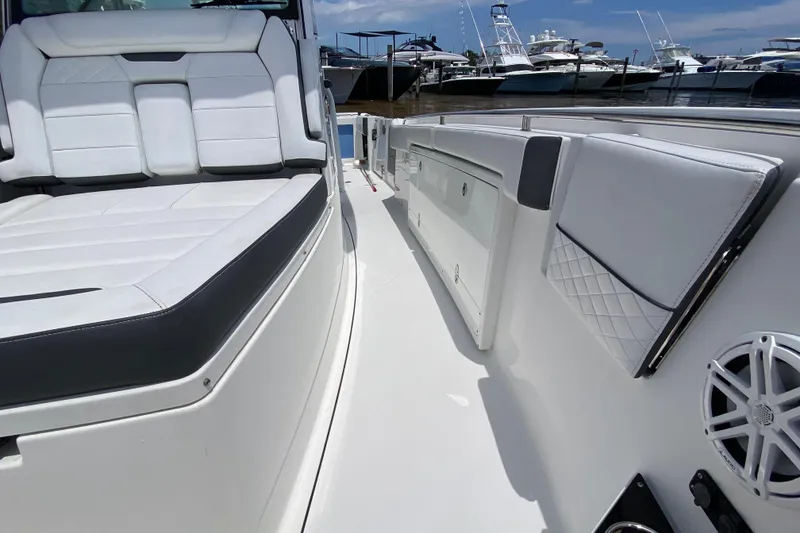 Slide: The Image of 2022 Blackfin 332 CC boat interior with white seating and sleek design. - 20