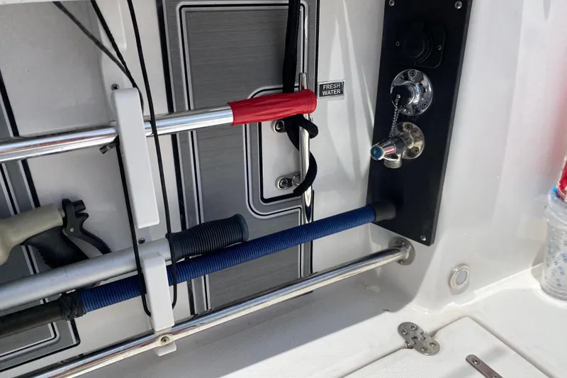 Slide: The Image of 2022 Blackfin 332 CC boat deck with fishing rod holders and fresh water access. - 34