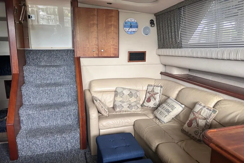 Slide: The Image of Interior of 2001 Cruisers Yachts 3750 Motoryacht with beige leather seating and nautical decor. - 13