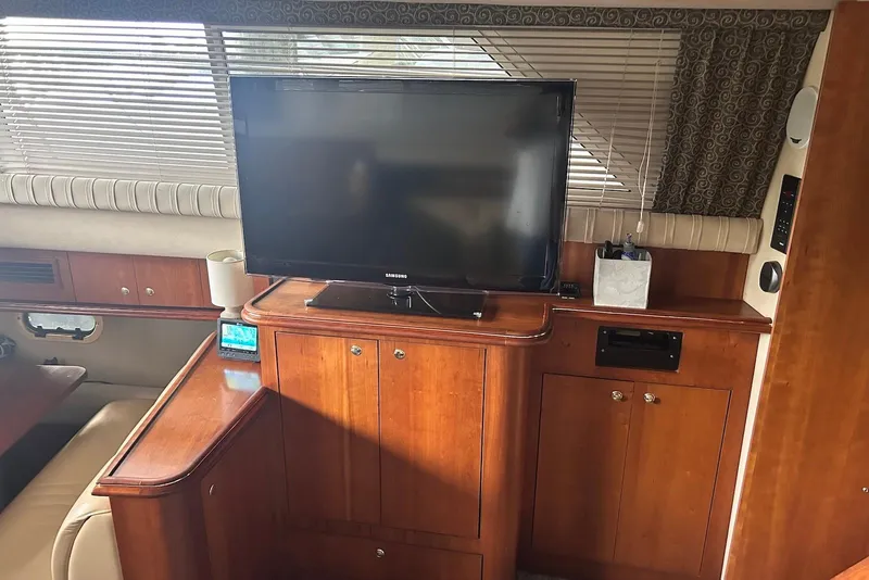 Slide: The Image of Interior of 2001 Cruisers Yachts 3750 Motoryacht with TV and wooden cabinetry. - 16
