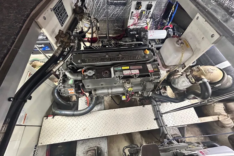 Slide: The Image of Engine room of 2001 Cruisers Yachts 3750 Motoryacht, showcasing detailed mechanical components. - 21