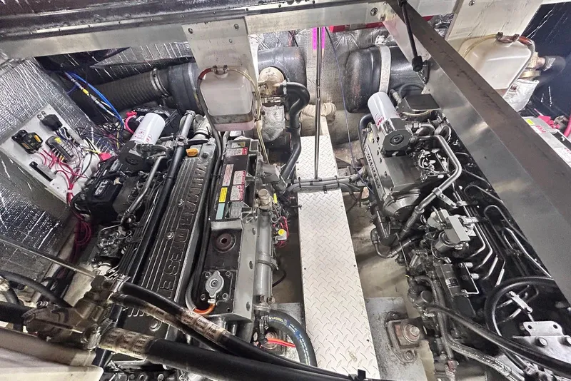 Slide: The Image of Engine room of 2001 Cruisers Yachts 3750 Motoryacht, featuring dual diesel engines. - 22