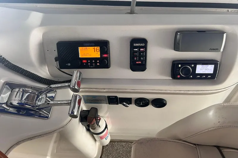 Slide: The Image of Control panel of a 2001 Cruisers Yachts 3750 Motoryacht with navigation and communication equipment. - 5