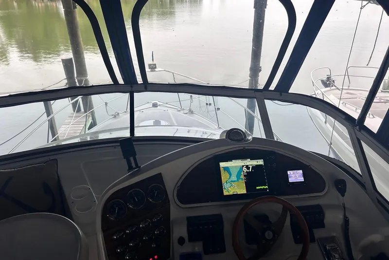 Slide: The Image of Interior view of 2001 Cruisers Yachts 3750 Motoryacht helm with navigation equipment. - 6