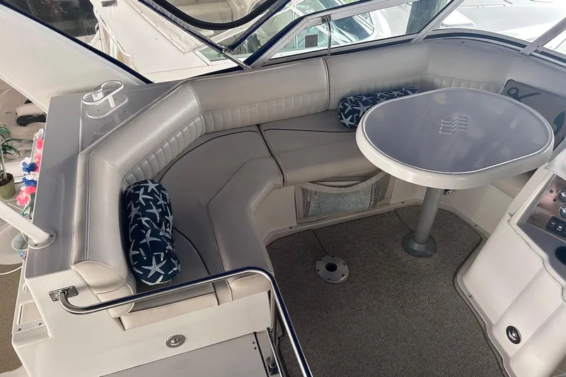Slide: The Image of 2001 Cruisers Yachts 3750 Motoryacht interior with cushioned seating and table. - 8