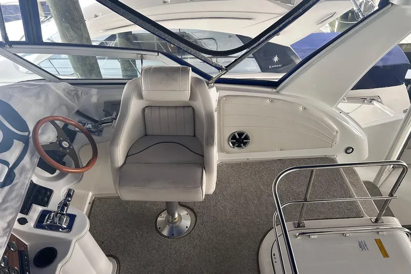 Slide: The Image of 2001 Cruisers Yachts 3750 Motoryacht helm with captain's chair and steering wheel. - 9