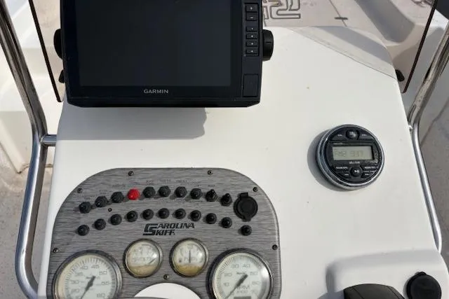Slide: The Image of 2019 Carolina Skiff 218 DLV dashboard with Garmin GPS and control panel. - 10