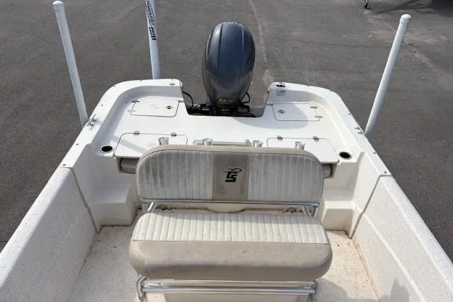Slide: The Image of 2019 Carolina Skiff 218 DLV boat interior with seating and motor, viewed from above. - 13