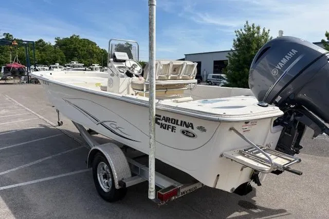 Slide: The Image of 2019 Carolina Skiff 218 DLV boat on trailer with Yamaha outboard motor. - 3
