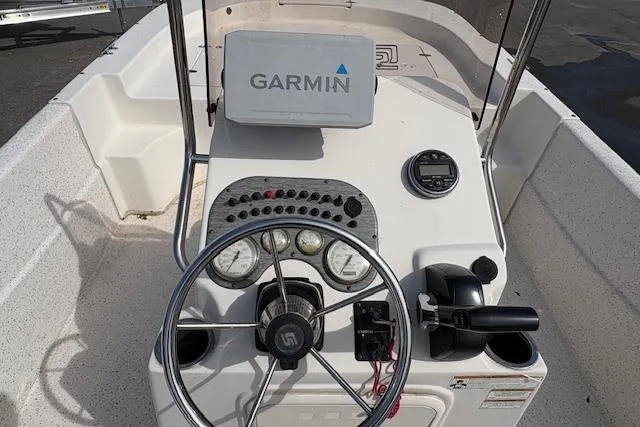 Slide: The Image of 2019 Carolina Skiff 218 DLV boat console with Garmin navigation system and steering wheel. - 6