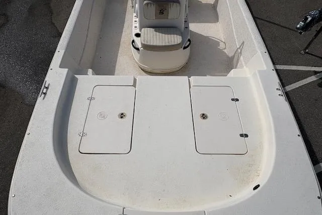 Slide: The Image of 2019 Carolina Skiff 218 DLV boat interior with storage compartments and seating. - 8