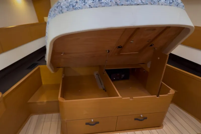 Slide: The Image of Under-bed storage compartment in 2018 Jeanneau 58 yacht cabin. - 20