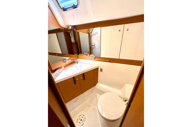 Slide: The Image of Luxurious bathroom in 2018 Jeanneau 58 yacht with modern fixtures and wood accents. - 28
