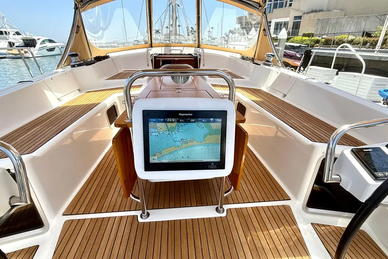 Slide: The Image of Cockpit of 2018 Jeanneau 58 yacht with navigation display and teak flooring. - 32