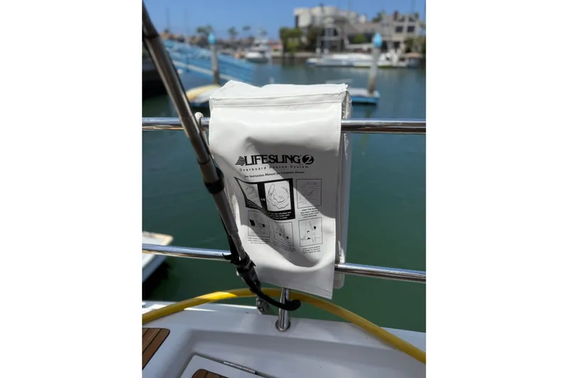 Slide: The Image of Lifesling overboard rescue system on 2018 Jeanneau 58 yacht, docked at marina. - 37