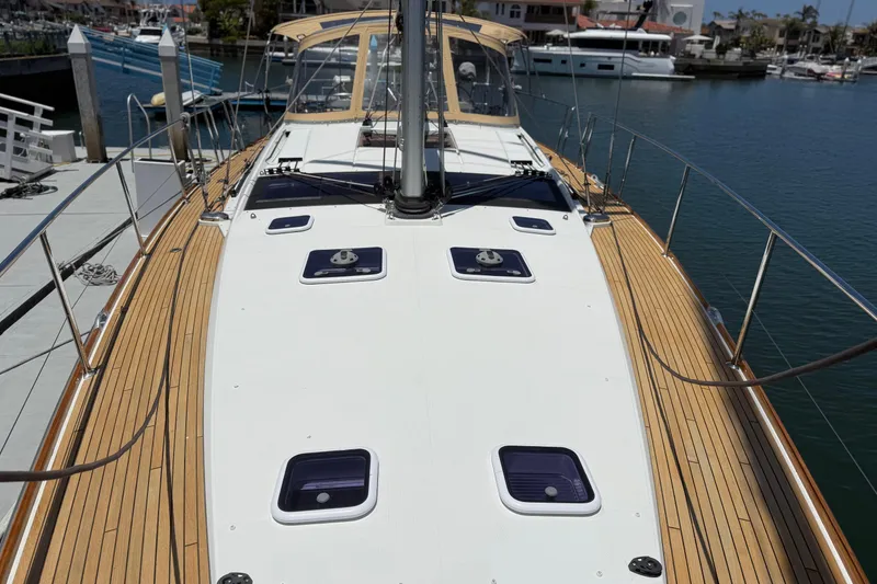 Slide: The Image of 2018 Jeanneau 58 yacht docked, showcasing sleek deck design and modern features. - 40