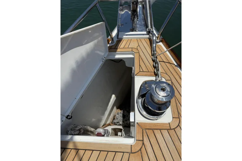 Slide: The Image of Anchor locker and winch on 2018 Jeanneau 58 yacht deck. - 41