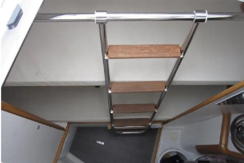 Slide: The Image of Interior view of 2018 Jeanneau 58 yacht ladder and cabin space. - 43