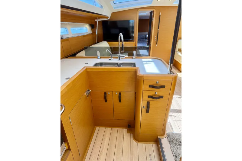 Slide: The Image of Luxurious interior of 2018 Jeanneau 58 yacht featuring modern kitchen design. - 7