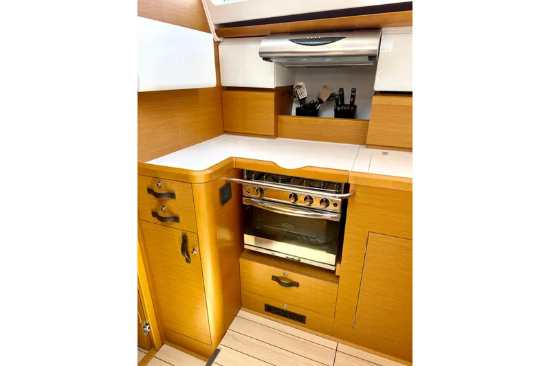 Slide: The Image of Modern kitchen in 2018 Jeanneau 58 yacht with wooden cabinetry and stainless steel oven. - 9