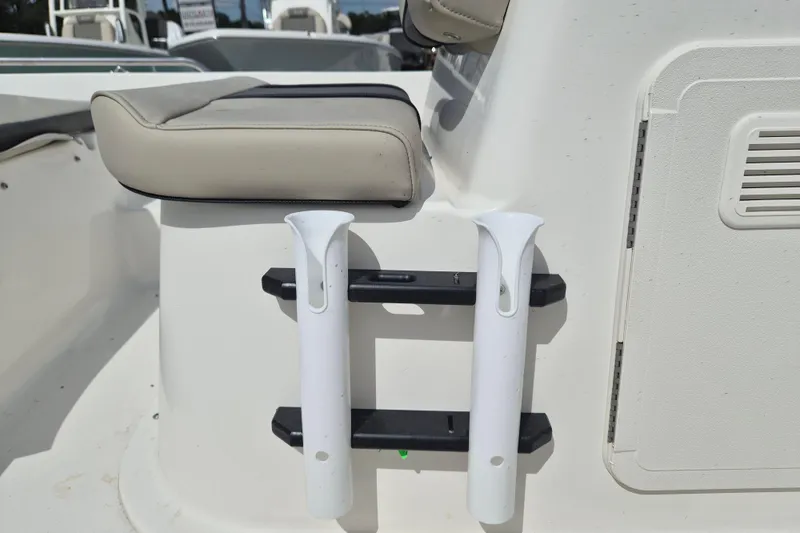 Slide: The Image of 2026 Key West 1720 Center Console boat seat and rod holders detail. - 11