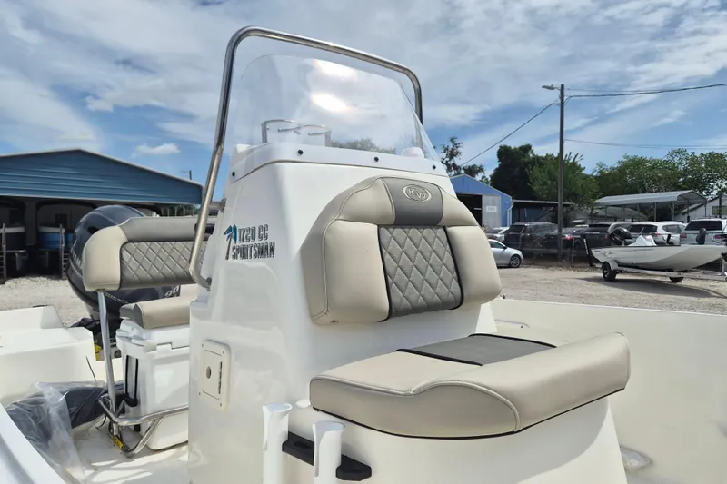 Slide: The Image of 2026 Key West 1720 Center Console boat with cushioned seating and console, parked outdoors. - 4