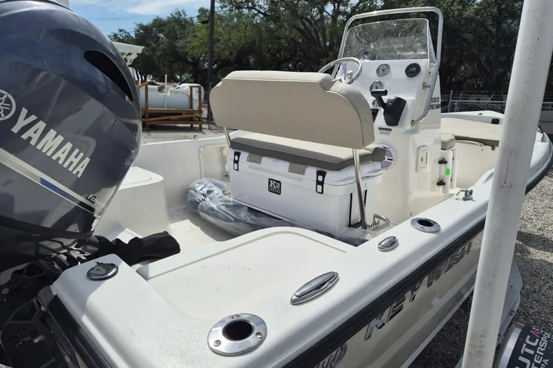 Slide: The Image of 2026 Key West 1720 Center Console boat with Yamaha engine, docked outdoors. - 7