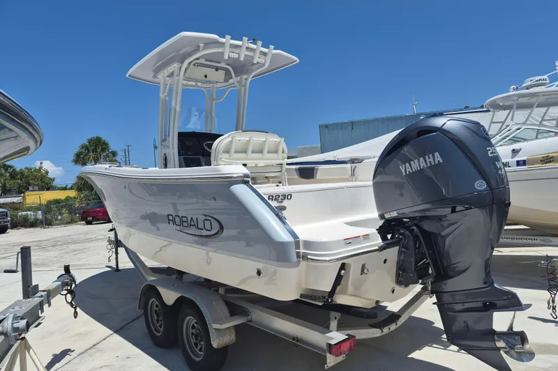 Slide: The Image of 2023 Robalo R230 Center Console boat with Yamaha engine on trailer. - 4