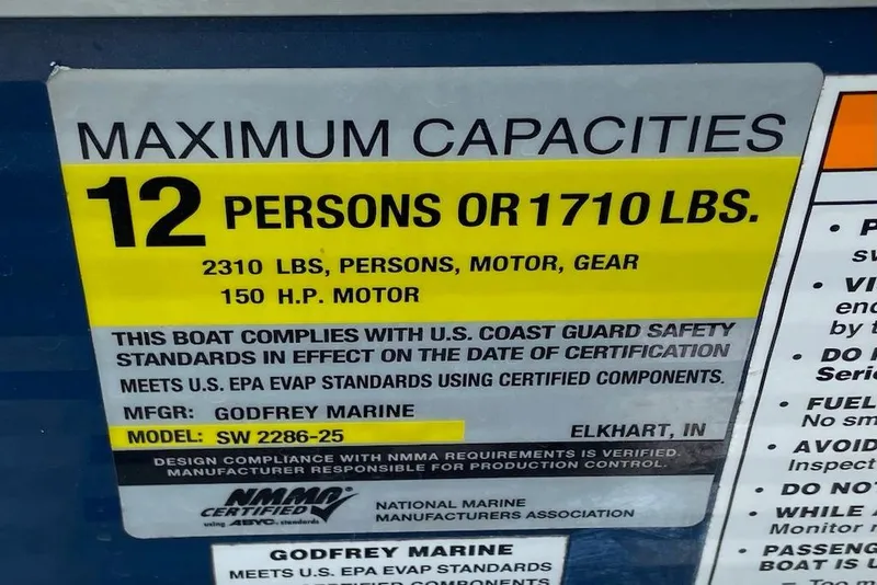 Slide: The Image of Maximum capacity label for 2021 Godfrey Sweetwater 2286 SBX boat, 12 persons or 1710 lbs. - 5
