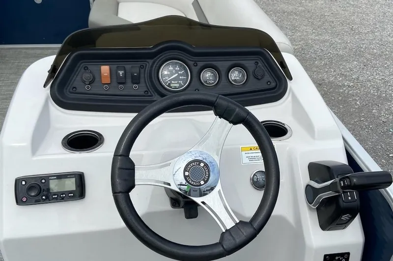 Slide: The Image of Steering console of 2021 Godfrey Sweetwater 2286 SBX pontoon boat with gauges and controls. - 6