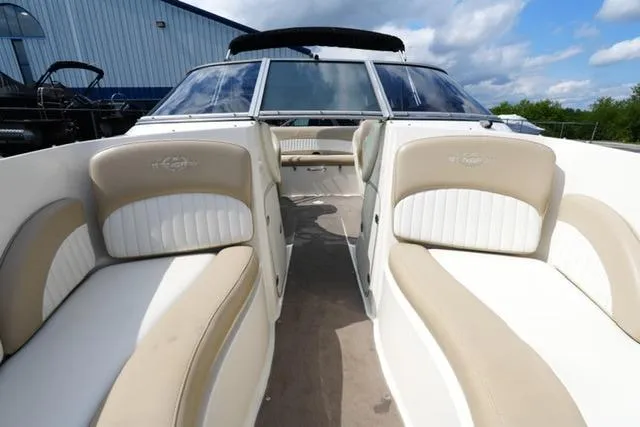 Slide: The Image of 2015 Stingray 208 LR boat interior with beige and white seating. - 18