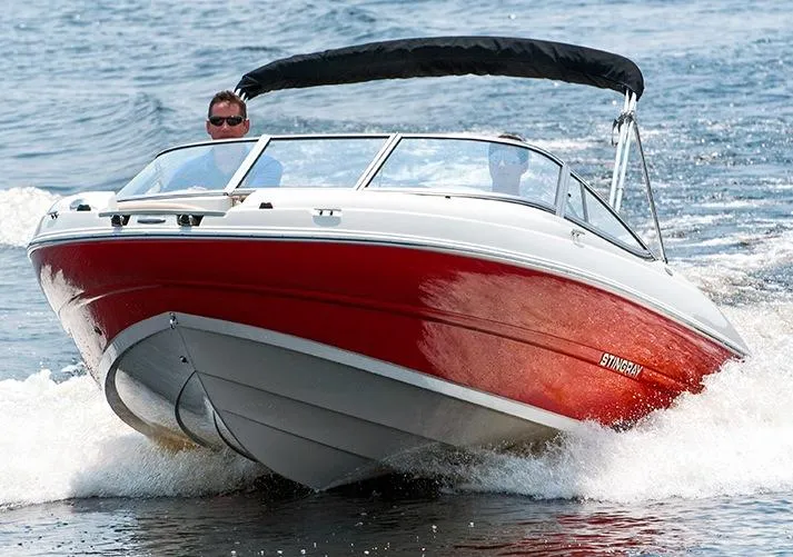 Slide: The Image of Manufacturer Provided Image: 2015 Stingray 208 LR boat cruising on water. - 3