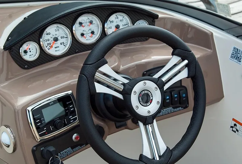 Slide: The Image of Manufacturer Provided Image: 2015 Stingray 208 LR boat dashboard with steering wheel and gauges. - 6