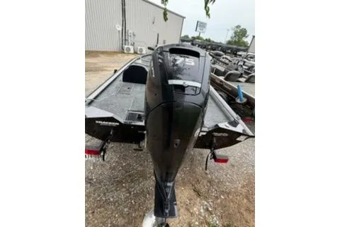 Slide: The Image of 2019 Tracker Pro Team 175 TXW boat with powerful outboard motor in a storage area. - 9