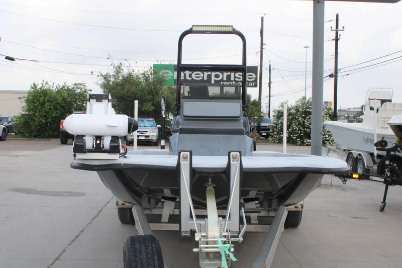 Slide: The Image of 2019 JH Performance Outlaw 230 boat on trailer in parking lot. - 10