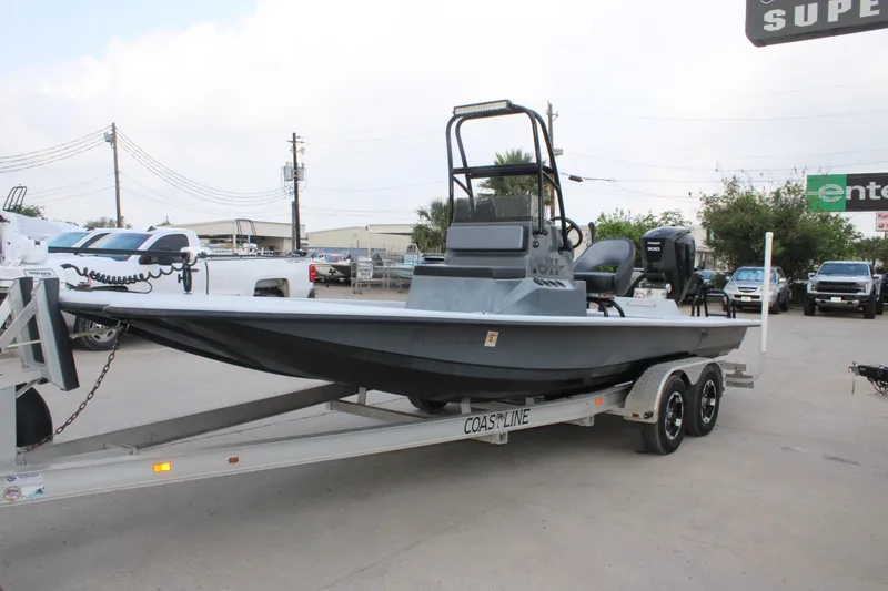 Slide: The Image of 2019 JH Performance Outlaw 230 boat on trailer in outdoor dealership lot. - 11