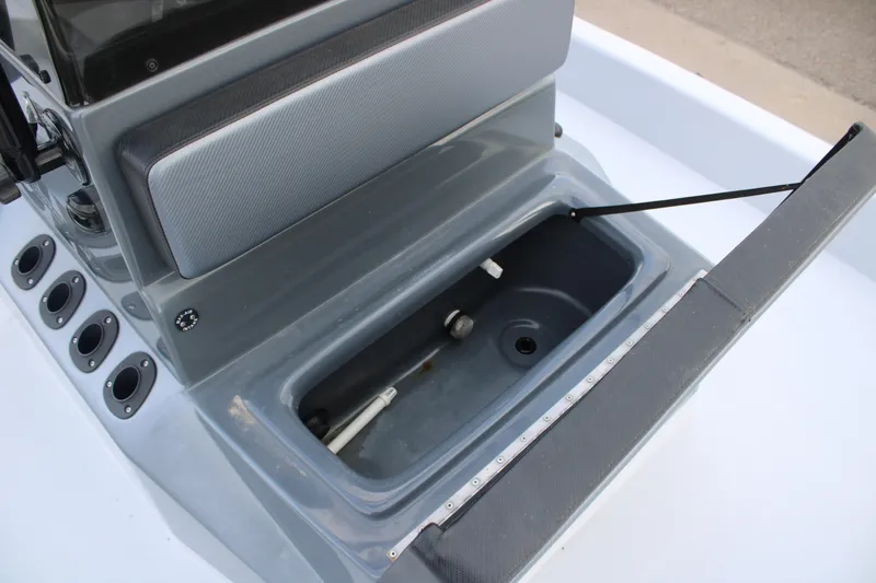 Slide: The Image of 2019 JH Performance Outlaw 230 boat console with open storage compartment. - 13