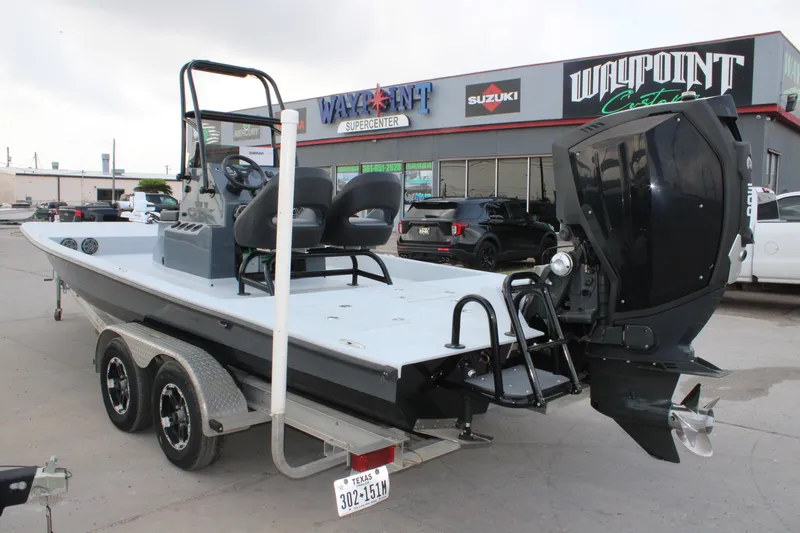 Slide: The Image of 2019 JH Performance Outlaw 230 boat on trailer outside dealership. - 14