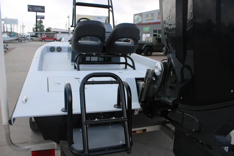 Slide: The Image of 2019 JH Performance Outlaw 230 boat rear view with motor and seating. - 15